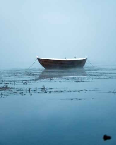 boat anchored in water